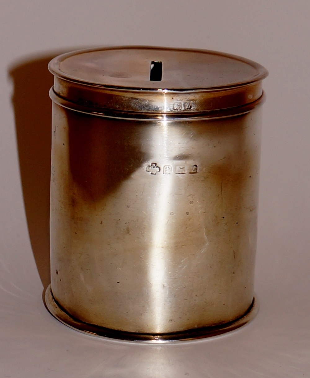 A George V silver money box of cylindrical design the pull off lid with coin aperture, 8 cm high, - Image 3 of 4