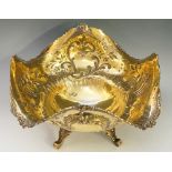 A silver & silver-gilt large table centrepiece, shaped square with wavy rim,