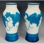 A pair of Chinese cameo glass inverted baluster vases, white glass cased in turquoise,