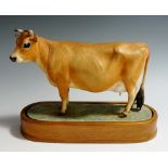 A Royal Worcester model of a Jersey cow modelled by Doris Lindner,