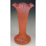 A 19th Century Stourbridge fluted pink glass vase, white dotted decoration, ruffled rim, 31cm high,