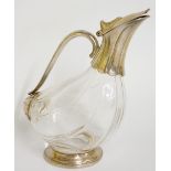 A moulded glass claret jug with silver plated mounts,