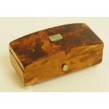 A miniature tortoiseshell veneered box, the domed hinged cover with rectangular white metal tablet,