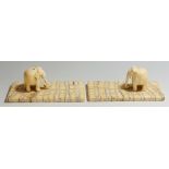 A pair of 19th Century miniature carved ivory elephants resting  on rectangular mammoth tooth bases,