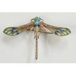 A Plique-à-Jour enamel dragonfly brooch the insect's eyes and abdomen set turquoise its wing edge
