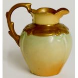 A Locke & Co Worcester jug of compressed urnular shape the body shaded apricot to pale blue with