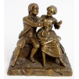 A 19th Century French bronze of a courting couple, seated, on rustic rectangular base, 13cm high,