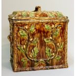 A Victorian majolica bread bin and cover of rectangular outline moulded overall with acorns and