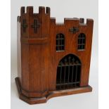 A late Victorian oak smoker's compendium, modelled as a castle with turret, castellated,