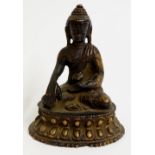 A Burmese bronze Buddha seated in the lotus position,