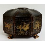 A Regency brown lacquer box decorated overall with gilt Chinoiserie scenes, gilt paw feet,