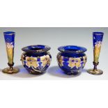 A pair of Bohemian Bristol blue bud vases enamelled with irises, gilded detailing, 12cm high,