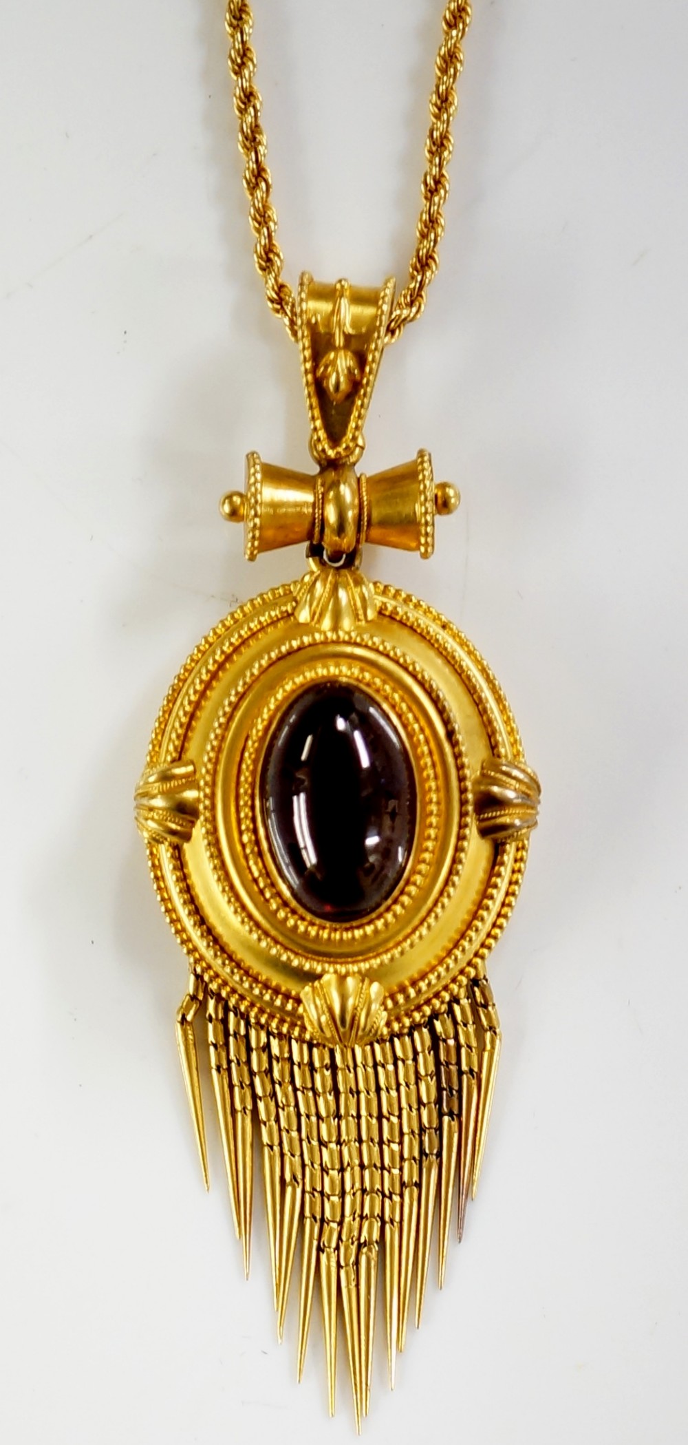 A Victorian gold pendant the stepped oval frame bead and leaf clasped with central oval garnet - Image 2 of 2