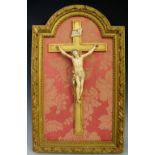 A 19th Century Italian ivory Corpus figure finely carved on a giltwood cross, signed Bondini,