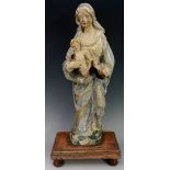 A 17th Century Spanish polychrome decorated figure of the Madonna and child,