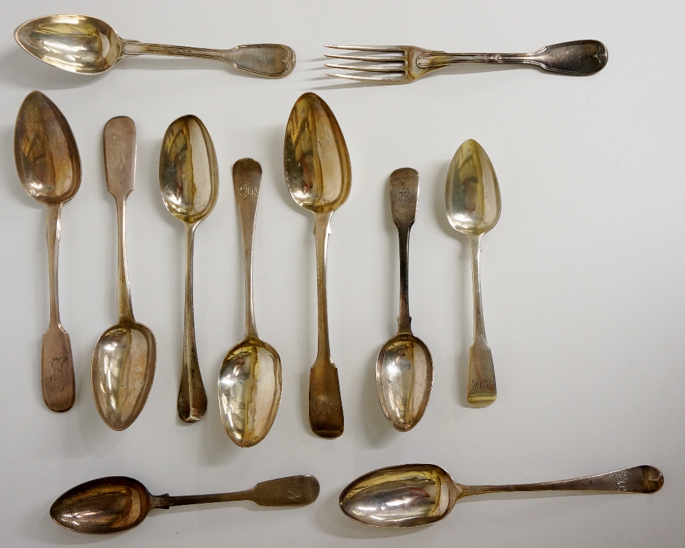 A quantity of 19th Century flatware including: 
Three Fiddle pattern dessert spoons, each engraved