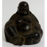 A bronze figure of a seated Buddha, 14.