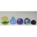 A collection of paperweights, Caithness 'May Dance' in green, Caithness 'Whispers' in blue,