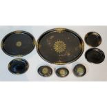 Two Victorian black Japanned tôleware oval trays, two small trays,