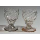 A pair of late 18th/early 19th Century diamond moulded Bonnet / Monteith glasses on petal feet,