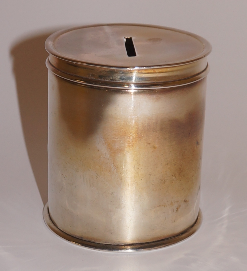 A George V silver money box of cylindrical design the pull off lid with coin aperture, 8 cm high, - Image 2 of 4