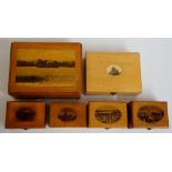 A collection of 19th Century Mauchline ware table boxes depicting: Clunie Loch and Castle;