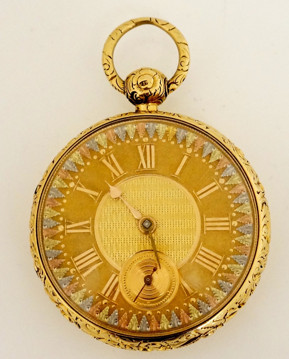 A fine English 18ct gold pocket watch with foliate cast case the back engine turned,