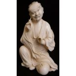 A Japanese ivory figure of a seated sage, pulling on his ear lobe, 10cm high, 6cm wide,