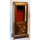 A Japanese display cabinet with waisted cornice, pierced floral trail above a glazed door,