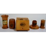 A selection of 19th Century Mauchline ware depicting: a coal scuttle shaped box with hinged lid,