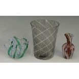 A miniature Murano glass vase decorated with stretched mutli-coloured canes;