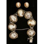 An 800 standard cameo bracelet alternately set with oval panels carved with female heads and