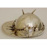 A unusual novelty ashtray modelled in the form of an inverted jockey's cap the riding crop with