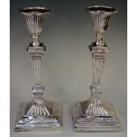 A pair of Victorian table candlesticks in Adam revival style with beaded sconces,