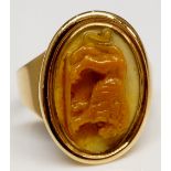 A Gentleman's 18th Century gold ring with oval intaglio finely carved with a lion,