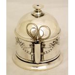 A George V string holder the domed top with pierced flattened finial the cylindrical body embossed