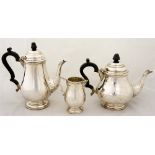 A three piece tea and coffee service in early George III style the baluster bodies with moulded