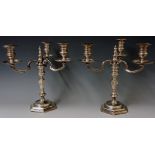 A pair of Queen Anne Style three branch candelabrum with scrolling branches,