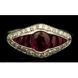 A ruby and diamond ring, lozenge set with central oval cut ruby,