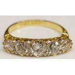 An 18ct yellow gold five stone diamond ring, the graduated brilliants claw set,