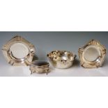 A pair of pentagonal ashtrays with circular centres and five depressions, moulded rims,