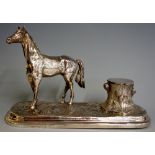 A desk inkwell the rounded rectangular rustic base with 'tree stump' well flanked by a horse,