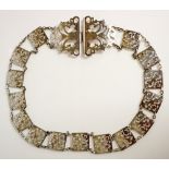 An Edward VII belt of pierced square and oval links, the buckle foliate engraved, 66cm long,