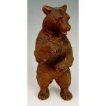 A standing bear with glass eyes and open mouth, 18cm high,