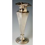 A hammer textured tapered octagonal vase with everted frilled neck, circular base, 20cm high,