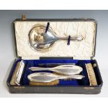 A six piece silver backed brush set, each piece engraved with the initial 'S', mirror 27cm long,