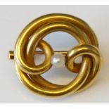 A Russian 18ct gold brooch of interlaced circular form centred on a pearl, 2.