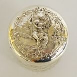A late Victorian silver topped jar the slightly domed cover embossed with a woman and infant in a