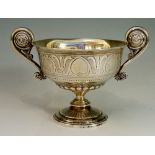 A Victorian two handled cup of shallow urnular form the body engraved with palmettes,