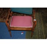 A Piano Stool with pink padded seat